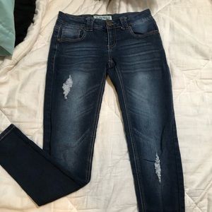 Distressed blue jeans